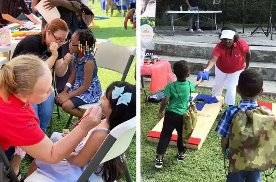 Kids getting their face painted and playing cornhole