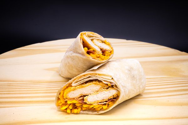 Blazing buffalo chicken wrap on a wood block