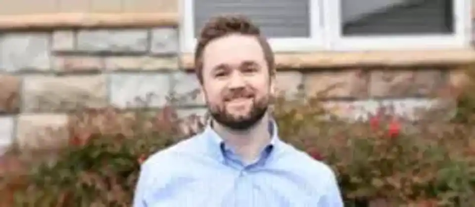 Portrait of man in front of building
