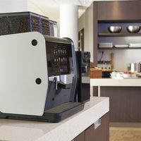 Coffee maker on bar
