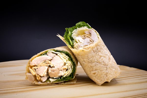 Garlic caesar wrap on a wood block