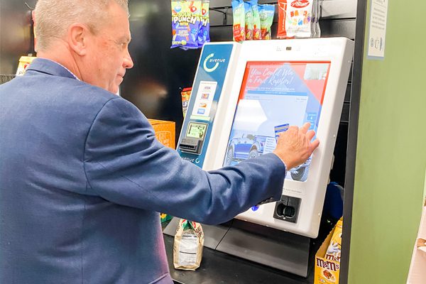 Man in suit paying for snacks