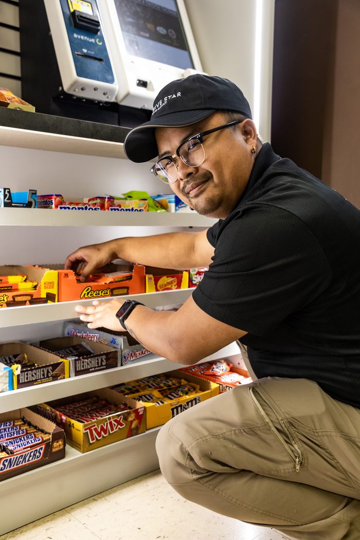Employee restocking snacks